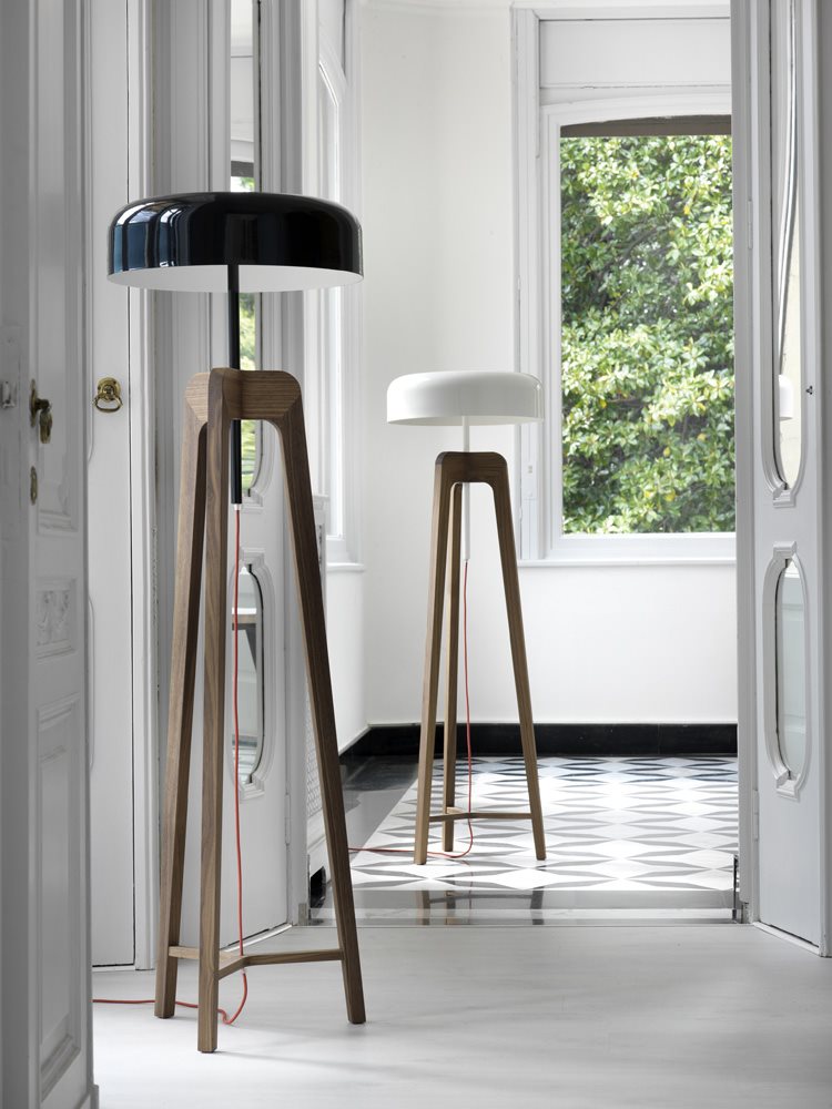 Pileo floor lamps in solid canaletta walnut or ash with tin-plated shade.