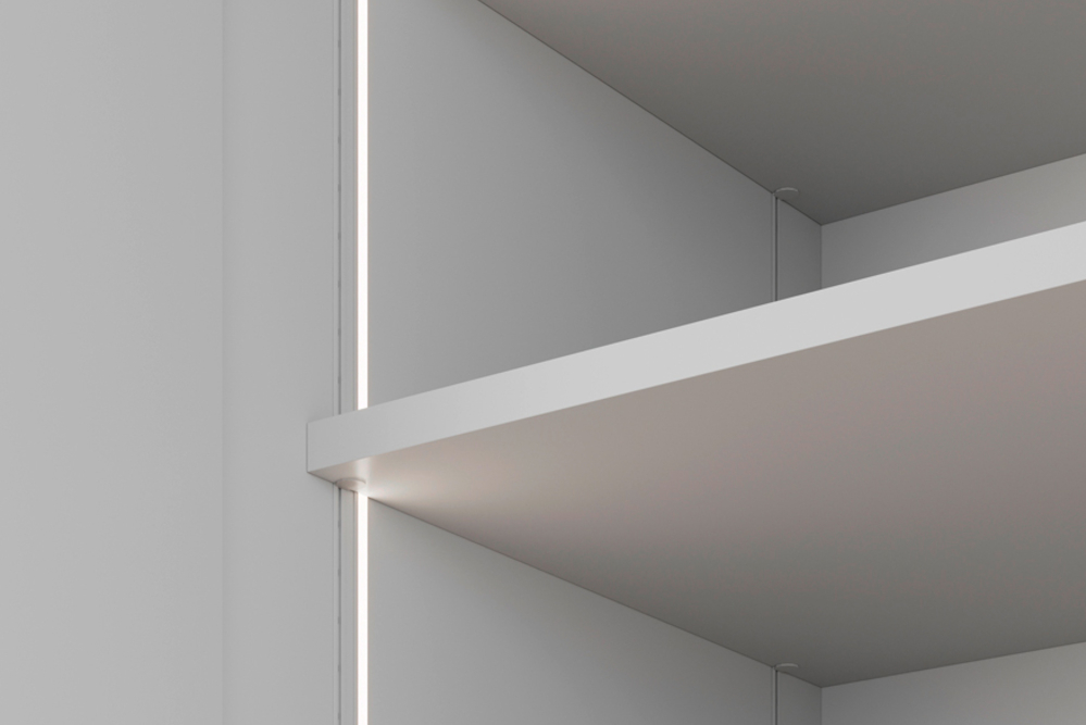 Standard height-adjustable shelf. LED lighting is integrated into the front of the wardrobe. The LED lighting switches on and off when the doors are opened and closed.